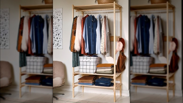 IKEA KRONÖREN open wardrobe with hanging clothes, folded clothes, and a cloth bin on the shelves