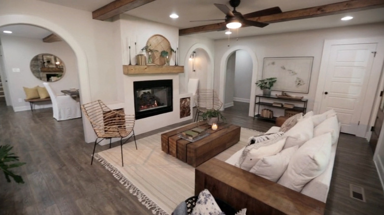 Interior of renovated home with built-in firewood cubbies by the fireplace