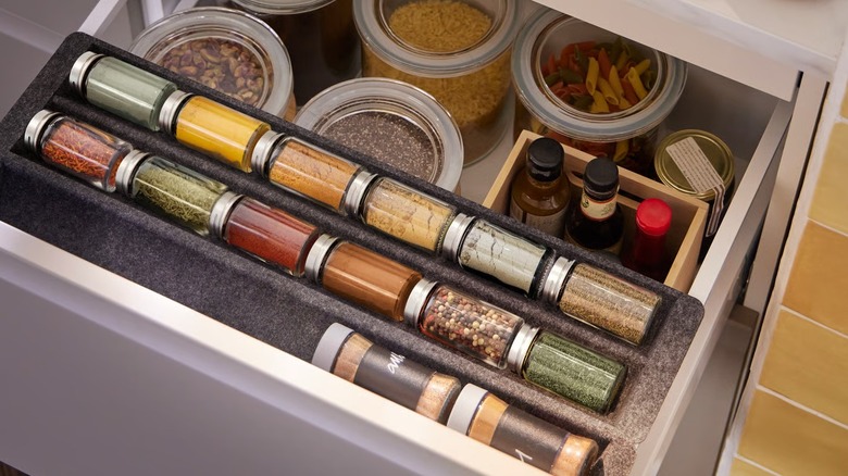 IKEA UPPDATERA Sliding Drawer Organizer in drawer above serving bowl storage
