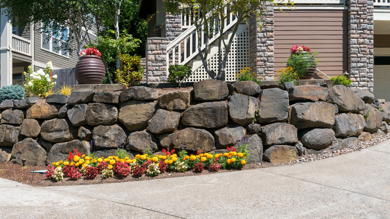 Suburban home with boulder edging for driveway