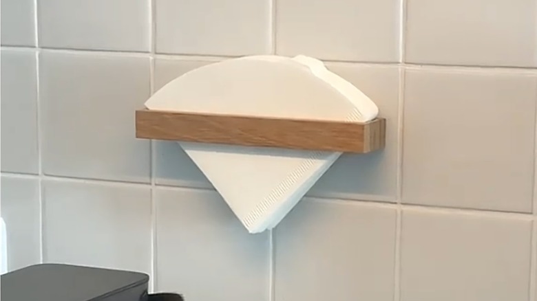DIY Coffee filter holder mounted on tile kitchen backsplash