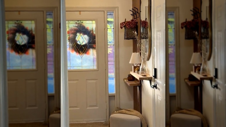Small entryway with floating shelves for storage