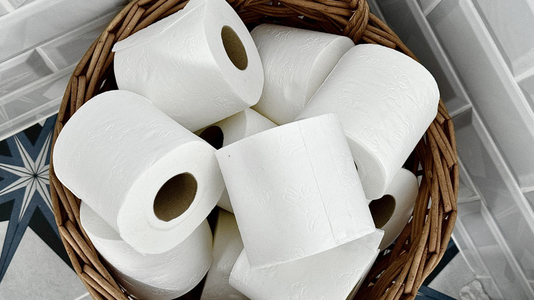 Top view of wicker basket full of toilet paper