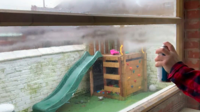 Applying frosted glass spray to interior glass