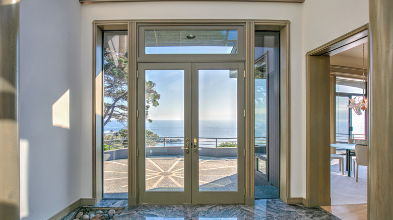 Front door with glass panes on the front of a house