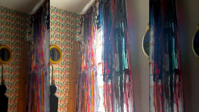 Boho-style window treatment created by unraveling a chindi rag rug