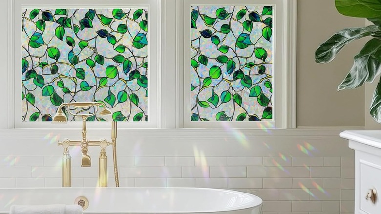 Modern bathroom with sunlight shining through vine decorated stained glass window cling