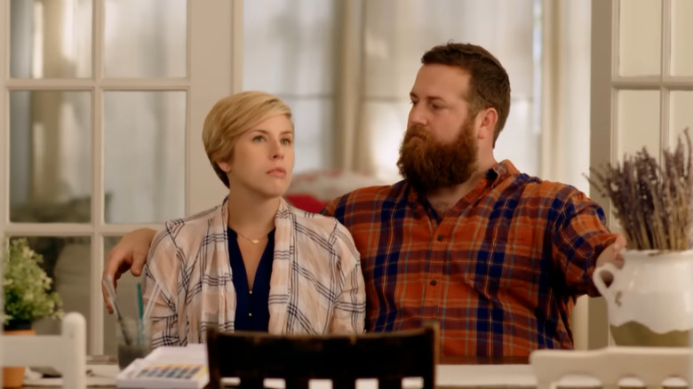 Erin and Ben Napier sitting at a table, looking thoughtful