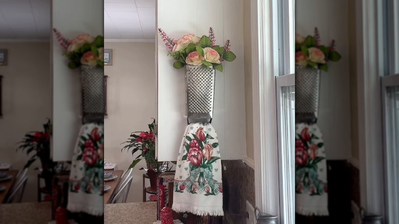 Cheese grater turned into kitchen towel storage solution
