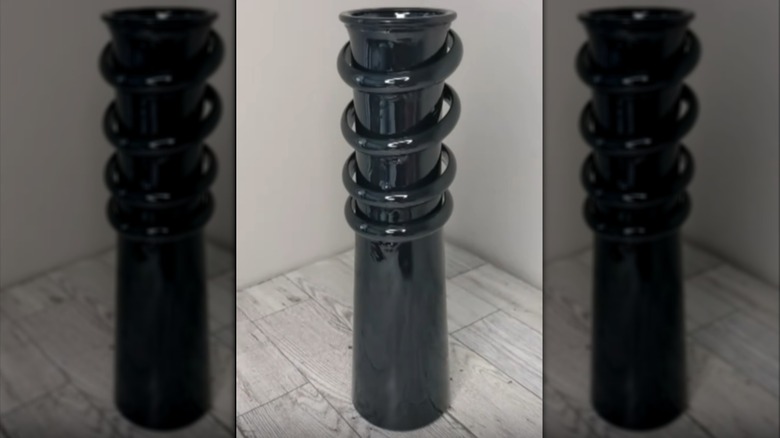 Slender vase accented with shower rings and painted black