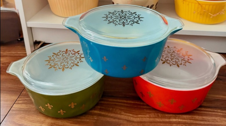 Three casserole dishes with the Pyrex Fleur de Lys pattern