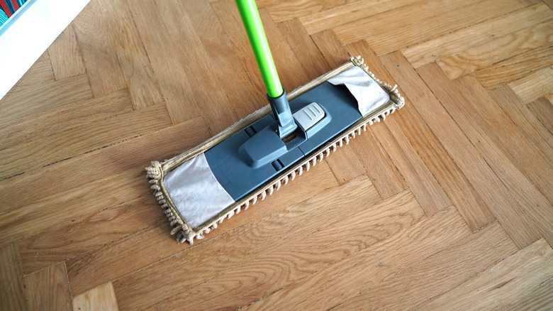 A microfiber mop on a hardwood floor
