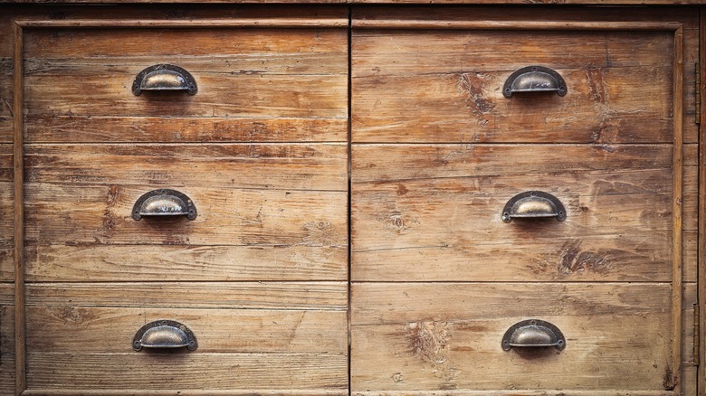 Old-time cabinet with six drawers and an uneven finish