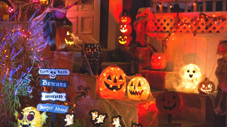 A variety of Halloween decor on a doorstep