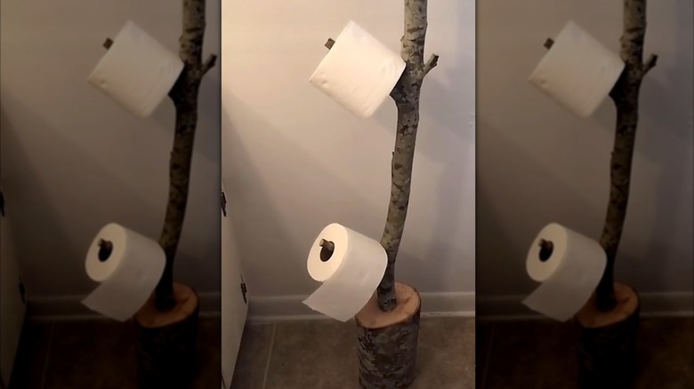 DIY tree limb toilet paper holder
