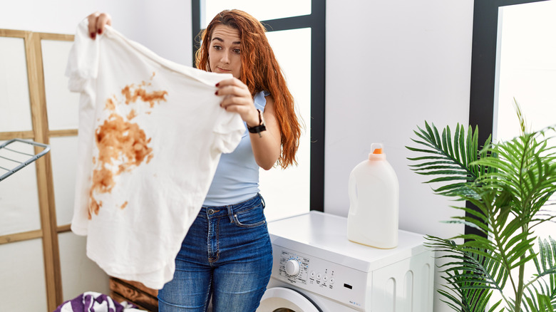 woman holding stained t shirt