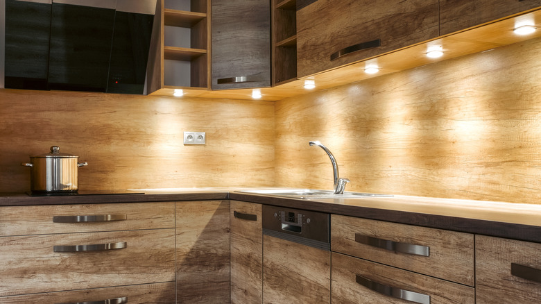 Wood paneled backsplash with sink