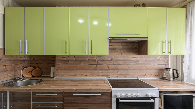 Kitchen with a wood backsplash