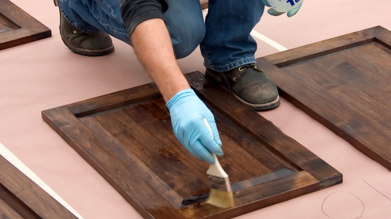 Putting dark stain on prefinished cabinet doors