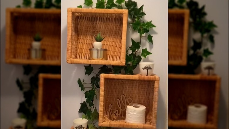 Baskets attached to the wall with toilet paper and decor