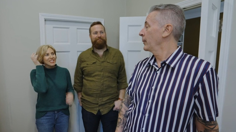 Erin Napier and husband Ben Napier talking with a man in striped shirt