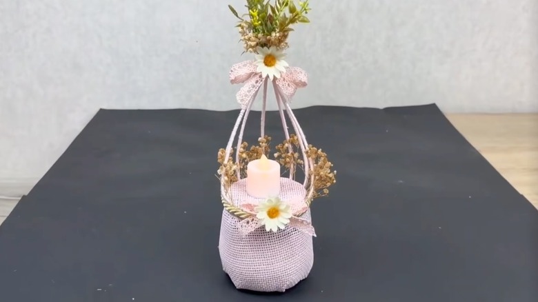 Pink LED candle holder with bird cage-like design