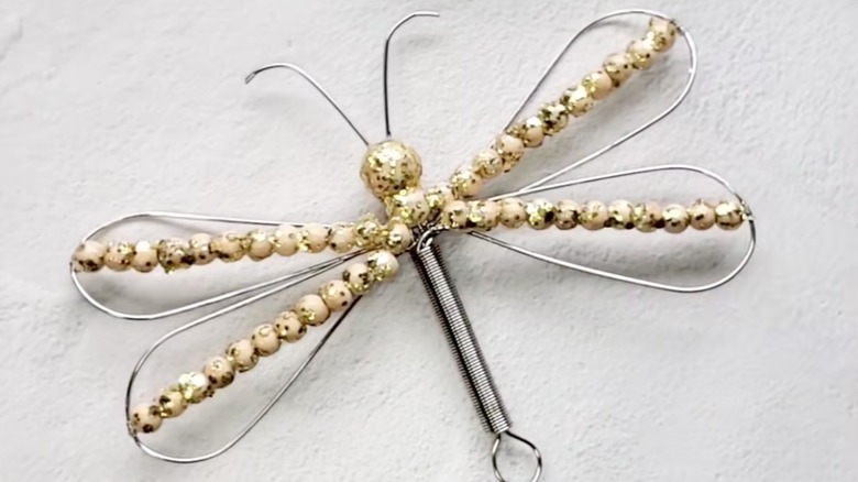 Dragonfly made using metal whisk and wood beads