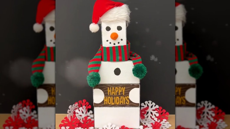 A festive snowman made from patio pavers