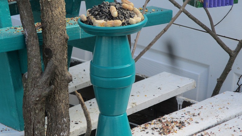 Old plant pots turned into a colorful DIY bird feeder