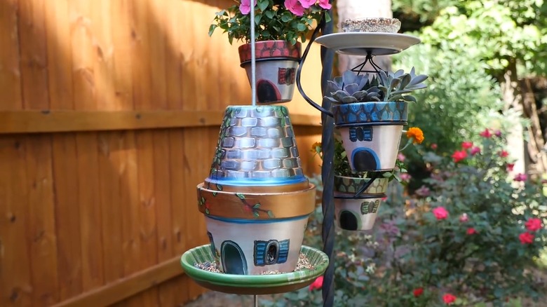 Fairy bird feeder village made from old pots