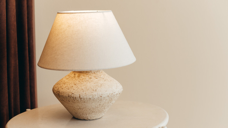 Modern textured white lamp on simple end table