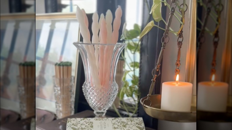 Tall glass vase used to hold pillar candles
