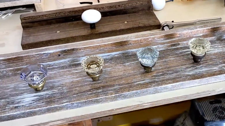 Door knobs attached to a wood board