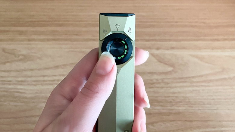 Close up of Olight ArkPro Ultra flashlight's operation control dial