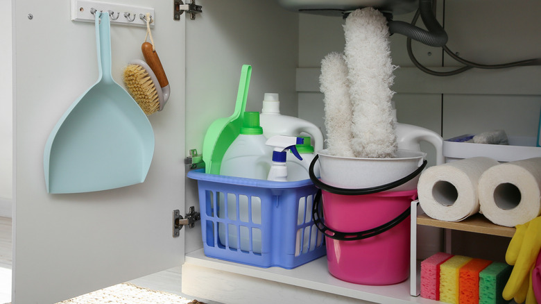 Baskets and shelves organizing under sink