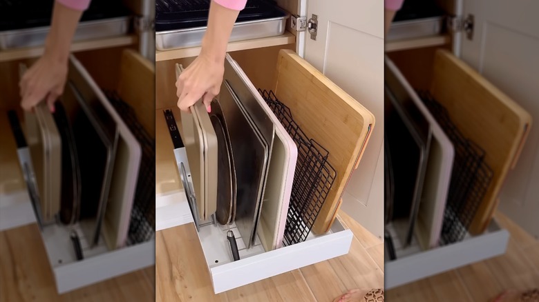 Vertical pan organizer on a slide-out cabinet shelf