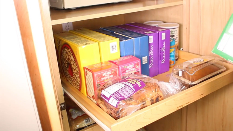 Slide-out cabinet shelves
