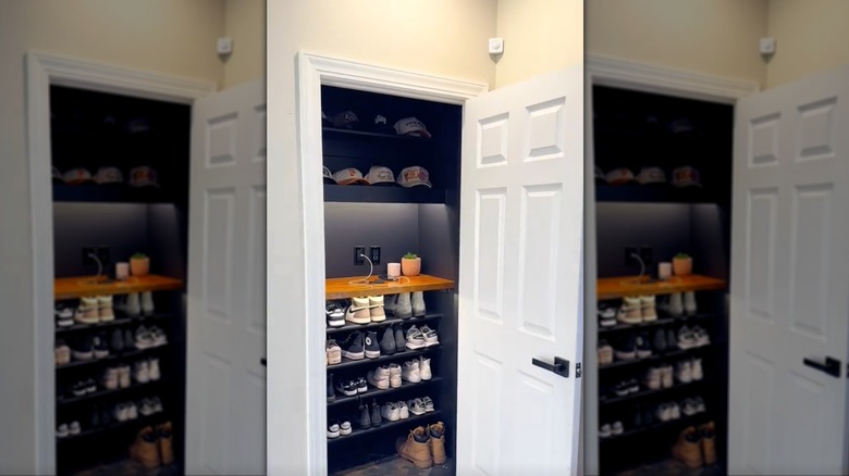 An entryway hall closet with built-in shoe shelves