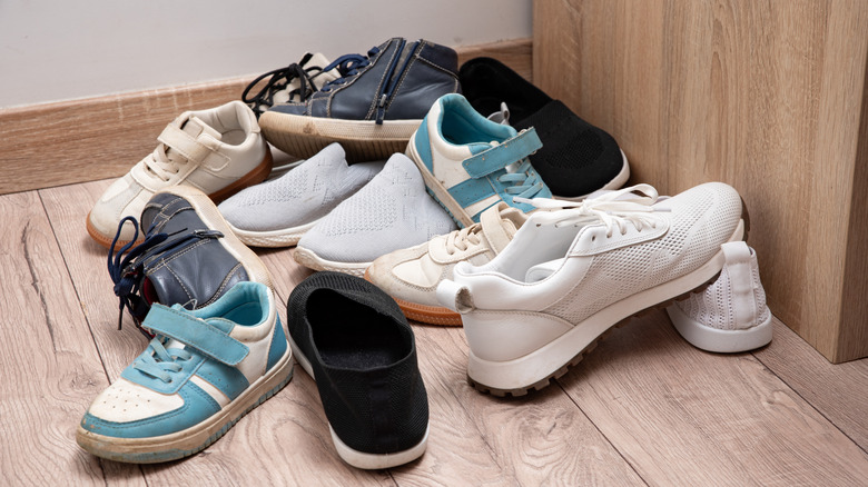 A jumble of shoes on the floor