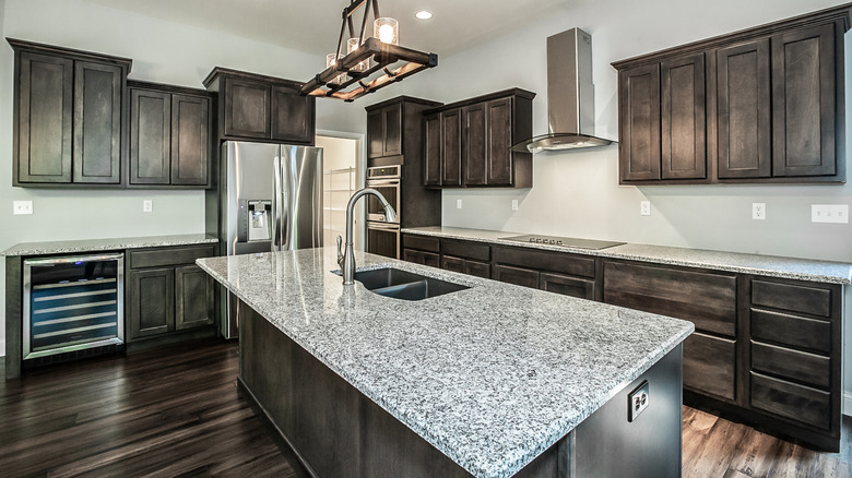 A kitchen with granite countertops.