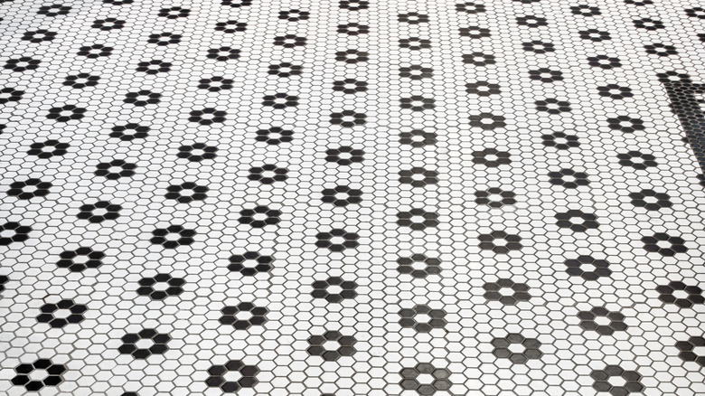 vintage black and white bathroom floor tile with flower pattern