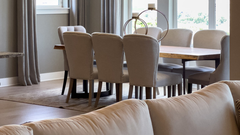 dining room table against a bunch of windows
