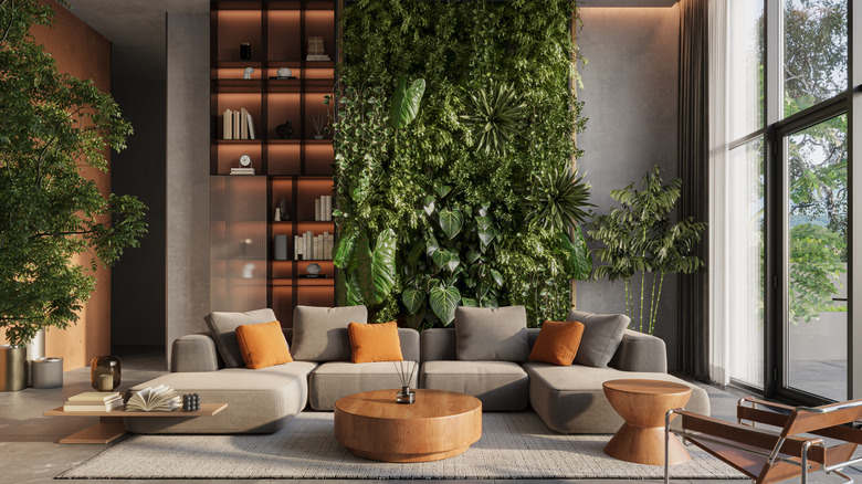 living room with a living plant wall behind the sofa
