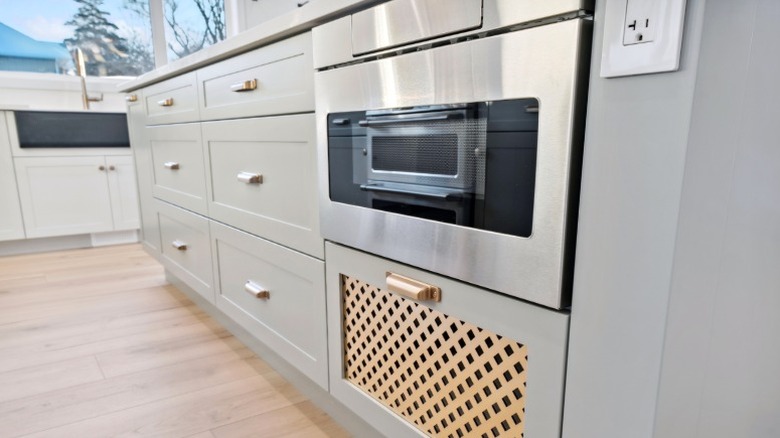 Microwave integrated as a drawer in a modern kitchen island