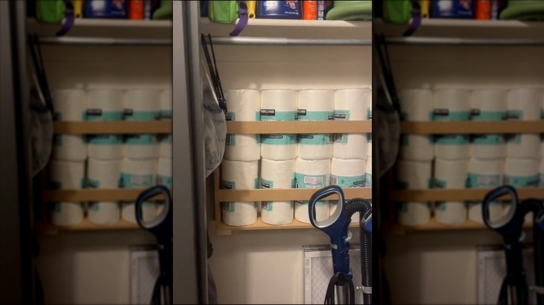 Pantry paper towel roll storage with rails to keep the stacked rolls in place