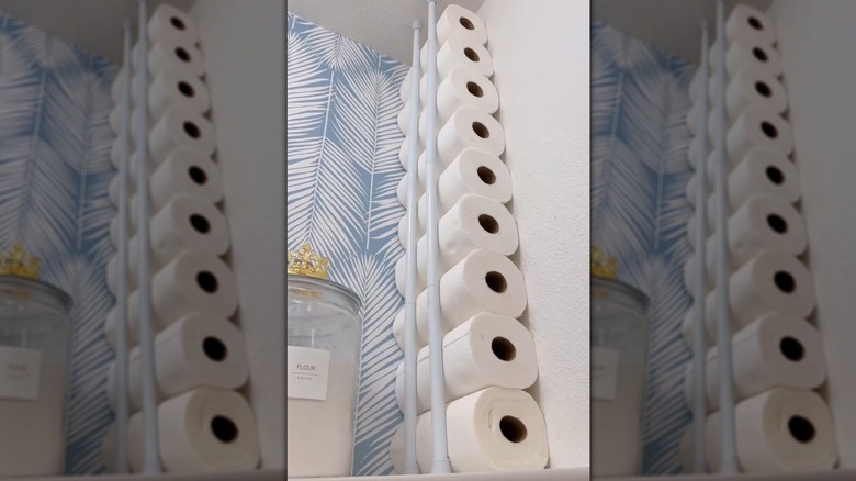 Space for paper towel storage created with two vertical tension rods