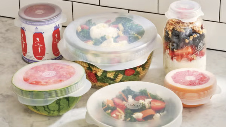 Containers, jars, and cut fruits with silicone lid coverings