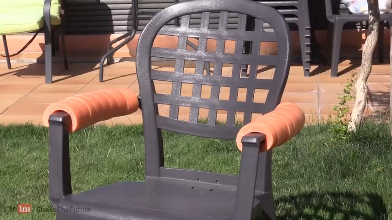 pool noodle used as cushion on plastic patio chair