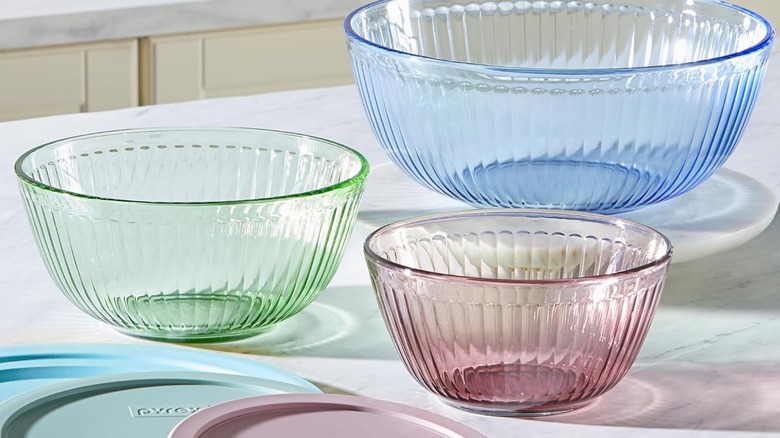 A set of three Pyrex mixing bowls in pastel blue, green, and pink