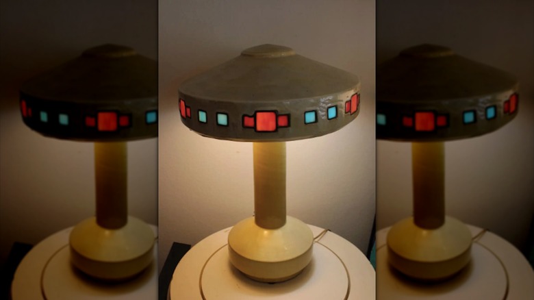Fulper Vasekraft pottery table lamp with cream-colored base and blue and red details on the shade
